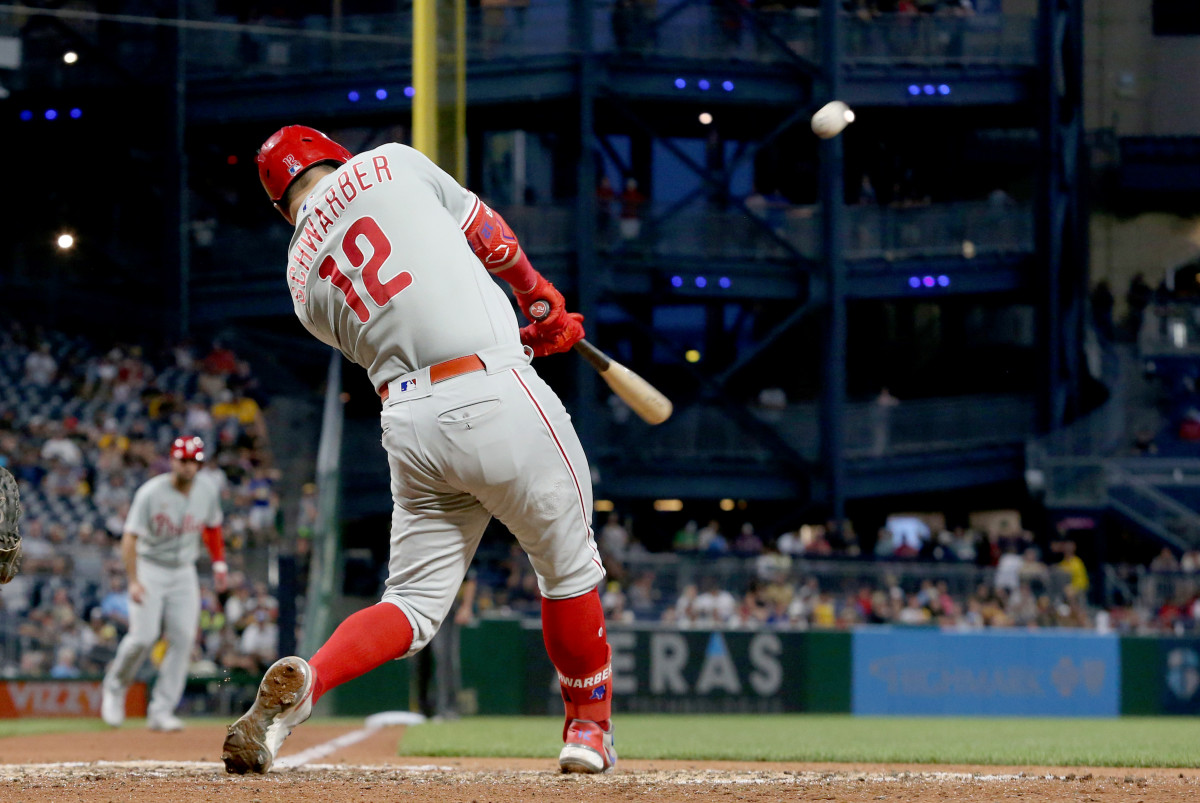 Jul 28, 2022; Pittsburgh, Pennsylvania, USA;  Philadelphia Phillies left fielder Kyle Schwarber (12) hits a three run home run against the Pittsburgh Pirates during the sixth  inning at PNC Park.