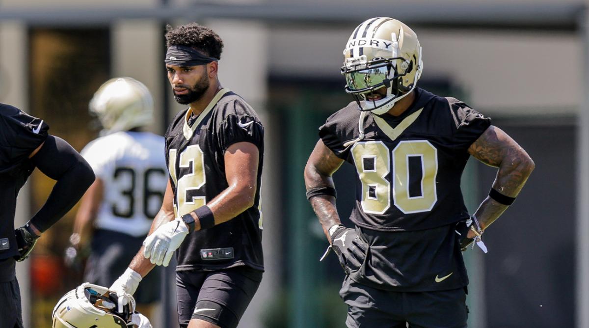 Jun 2, 2022; Metairie, LA, USA; New Orleans Saints Chris Olave (12) and Jarvis Landry (80) look on during organized team activities at the New Orleans Saints Training Facility.
