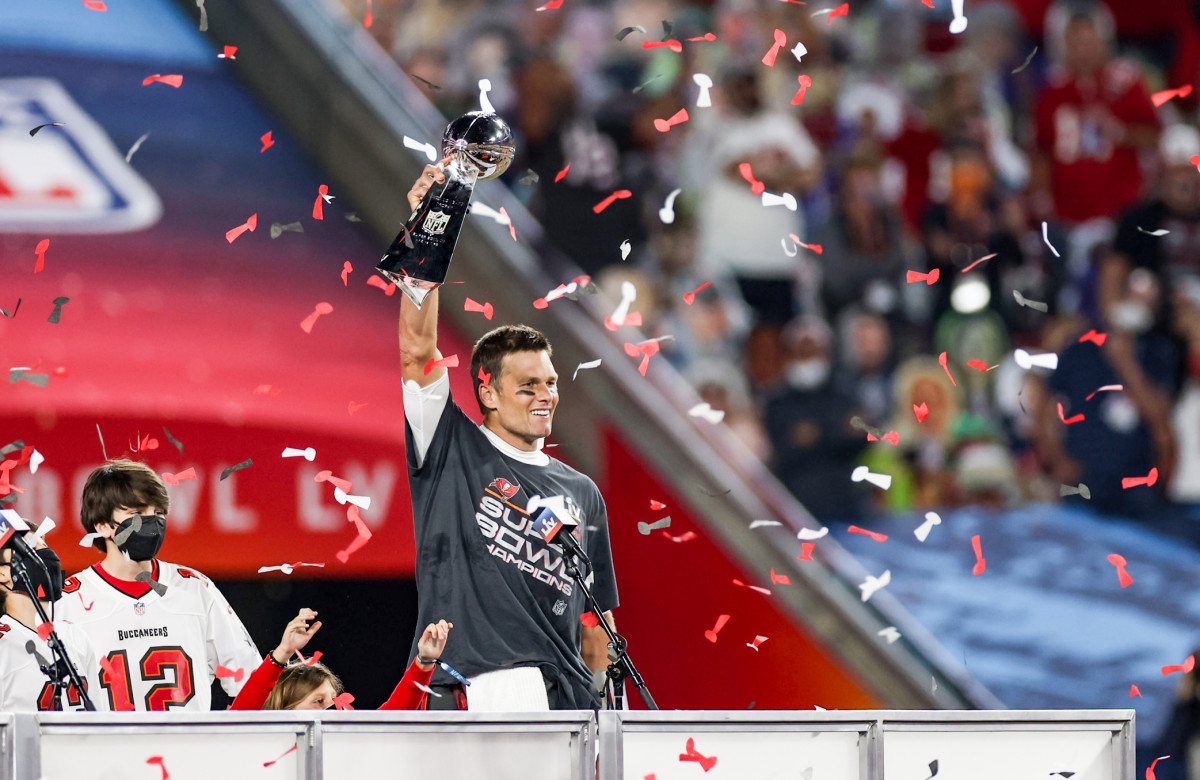 Tom Brady holding the Lombardi Trophy after winning Super Bowl LV with the Buccaneers
