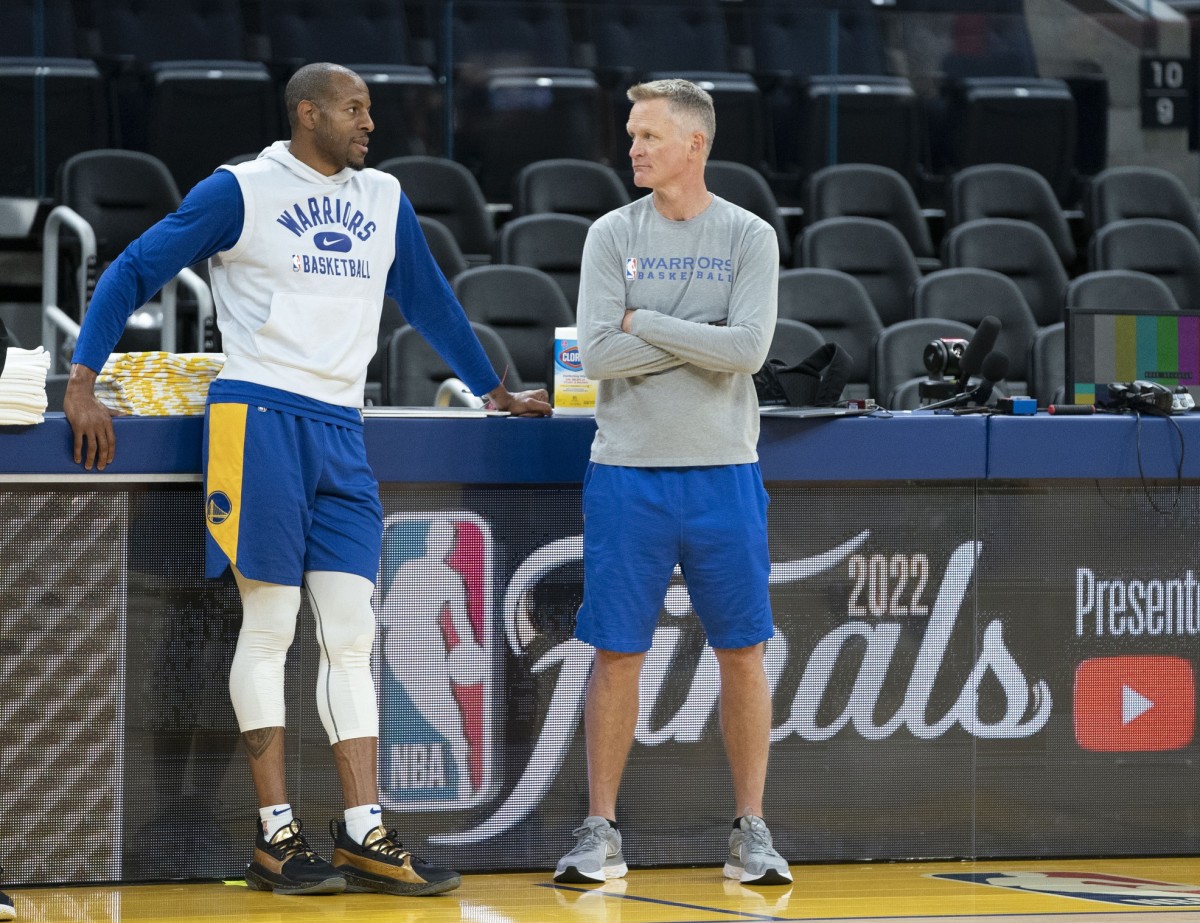June 1, 2022; San Francisco, CA, USA; Golden State Warriors forward Andre Iguodala (9, left) and head coach Steve Kerr (right) talk during media day of the 2022 NBA Finals at Chase Center. Mandatory Credit: Kyle Terada-USA TODAY Sports