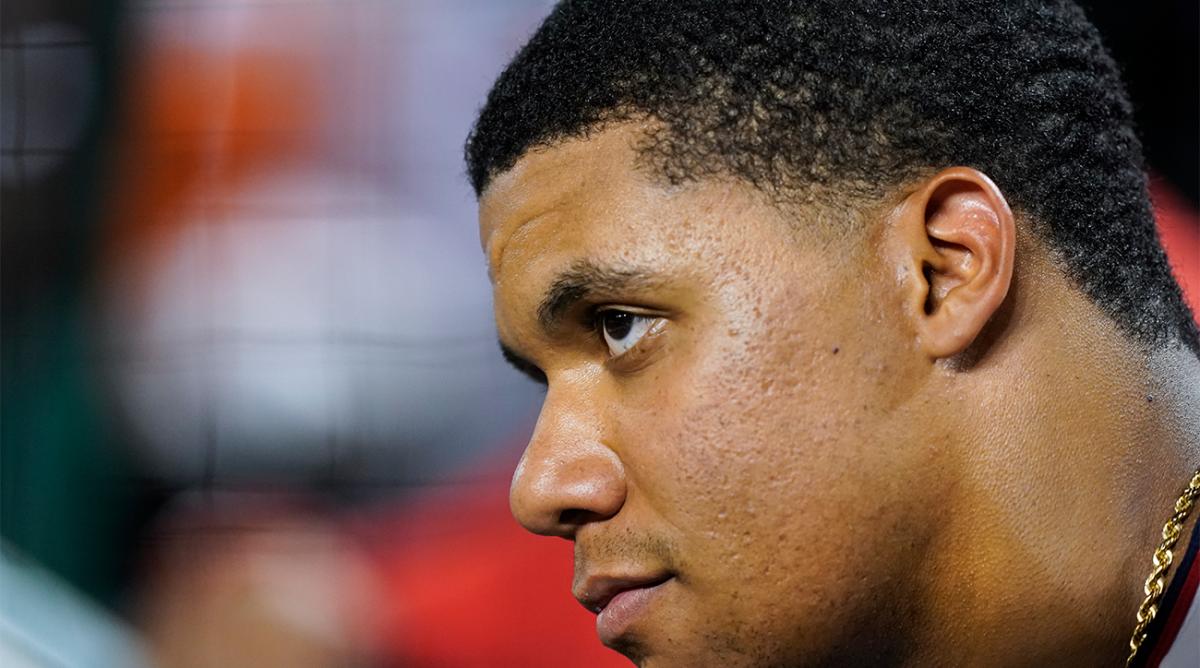 Washington Nationals’ Juan Soto watches a baseball game from the dugout during the ninth inning against the New York Mets at Nationals Park, Monday, Aug. 1, 2022, in Washington.