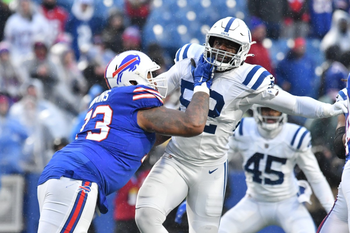 Nov 21, 2021; Orchard Park, New York, USA; Indianapolis Colts defensive end Ben Banogu (52) is blocked by Buffalo Bills offensive tackle Dion Dawkins (73) in the fourth quarter at Highmark Stadium. Mandatory Credit: Mark Konezny-USA TODAY Sports