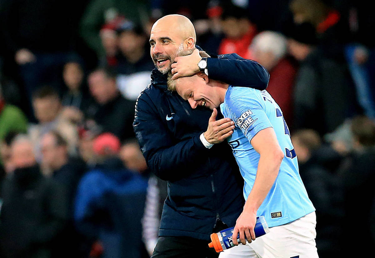 Manchester City manager Pep Guardiola (left) pictured hugging Oleksandr Zinchenko after a game in 2019
