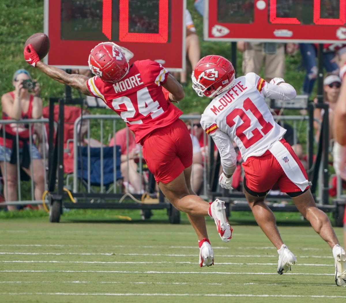 Jul 27, 2022; St. Joseph, MO, USA; Kansas City Chiefs wide receiver Skyy Moore (24) attempts a one handed catch as cornerback Trent McDuffie (21) defends during training camp at Missouri Western State University. Mandatory Credit: Denny Medley-USA TODAY Sports