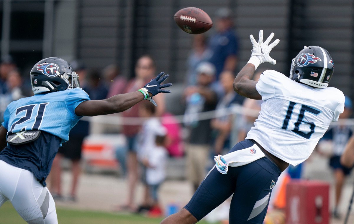 Tennessee Titans wide receiver Treylon Burks (16) pulls in a catch past cornerback Roger McCreary (21) during a training camp practice at Ascension Saint Thomas Sports Park Tuesday, Aug. 2, 2022, in Nashville, Tenn.