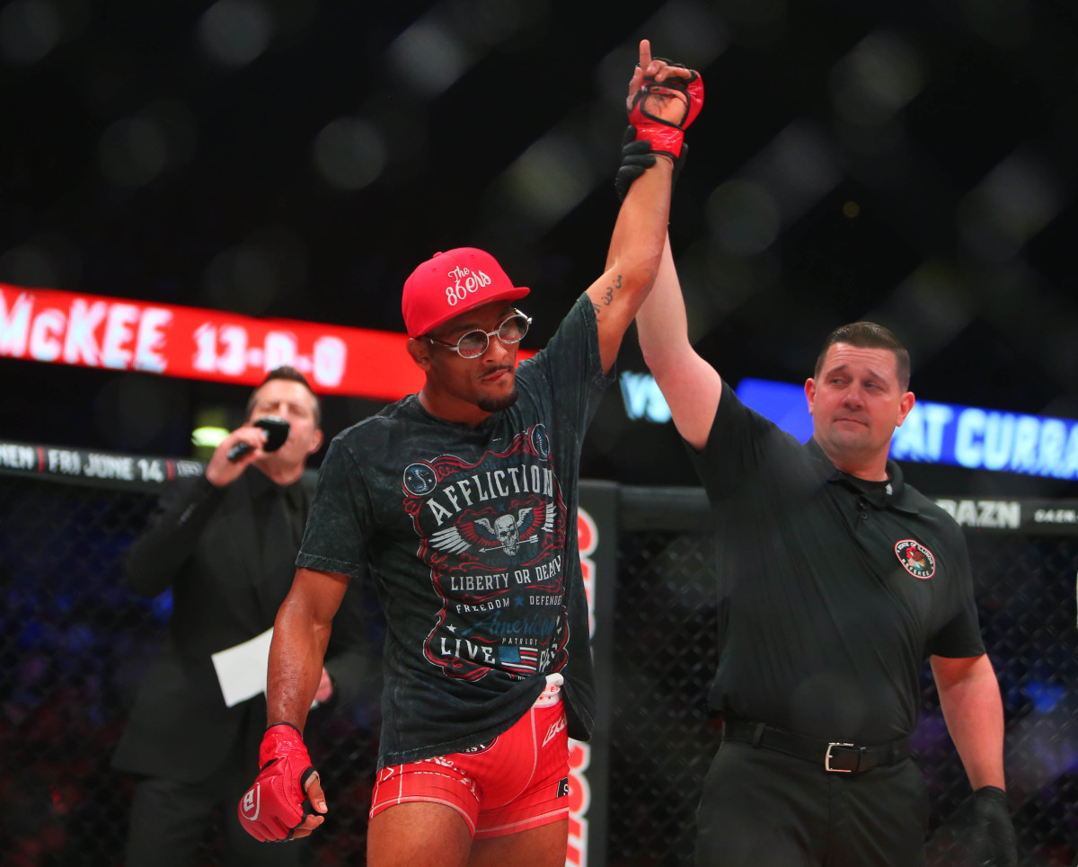 A.J. McKee (red gloves) defeats Pat Curran (blue gloves) during Bellator 221 at Allstate Arena.