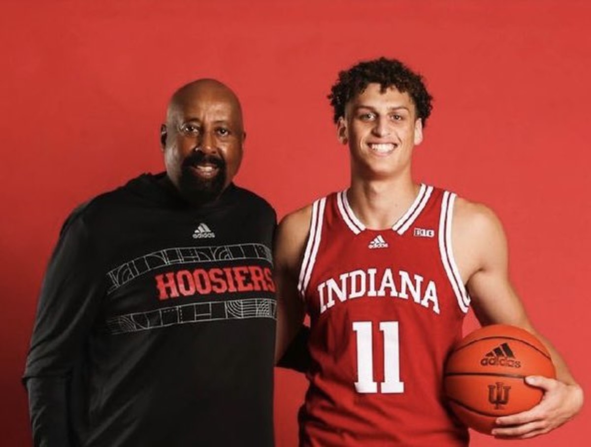 Indiana recruiting target Jamie Kaiser Jr. poses with coach Mike Woodson during his official visit to Indiana on July 25.