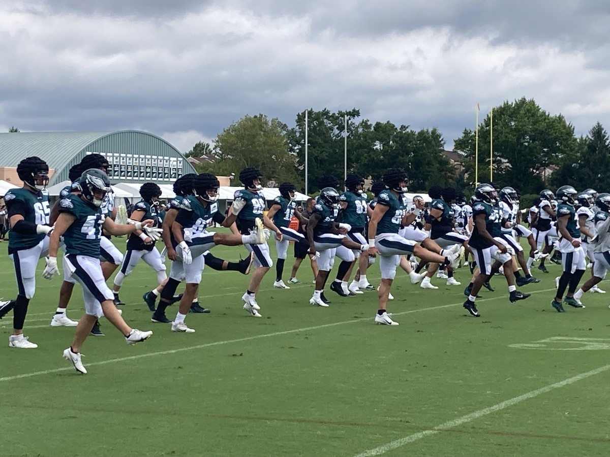 Eagles warm up prior to practice on Aug. 6, 2022