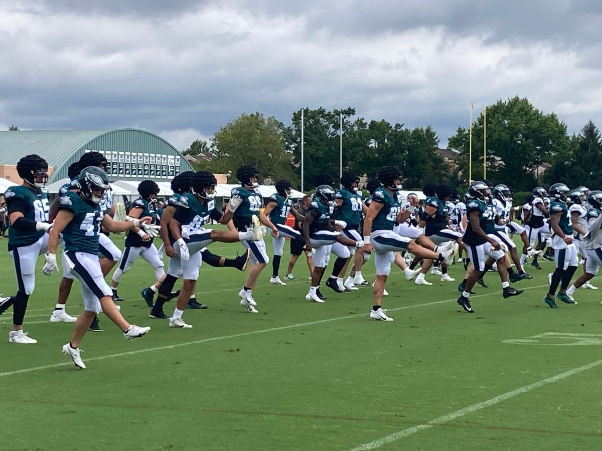 Eagles warm up prior to practice on Aug. 6, 2022