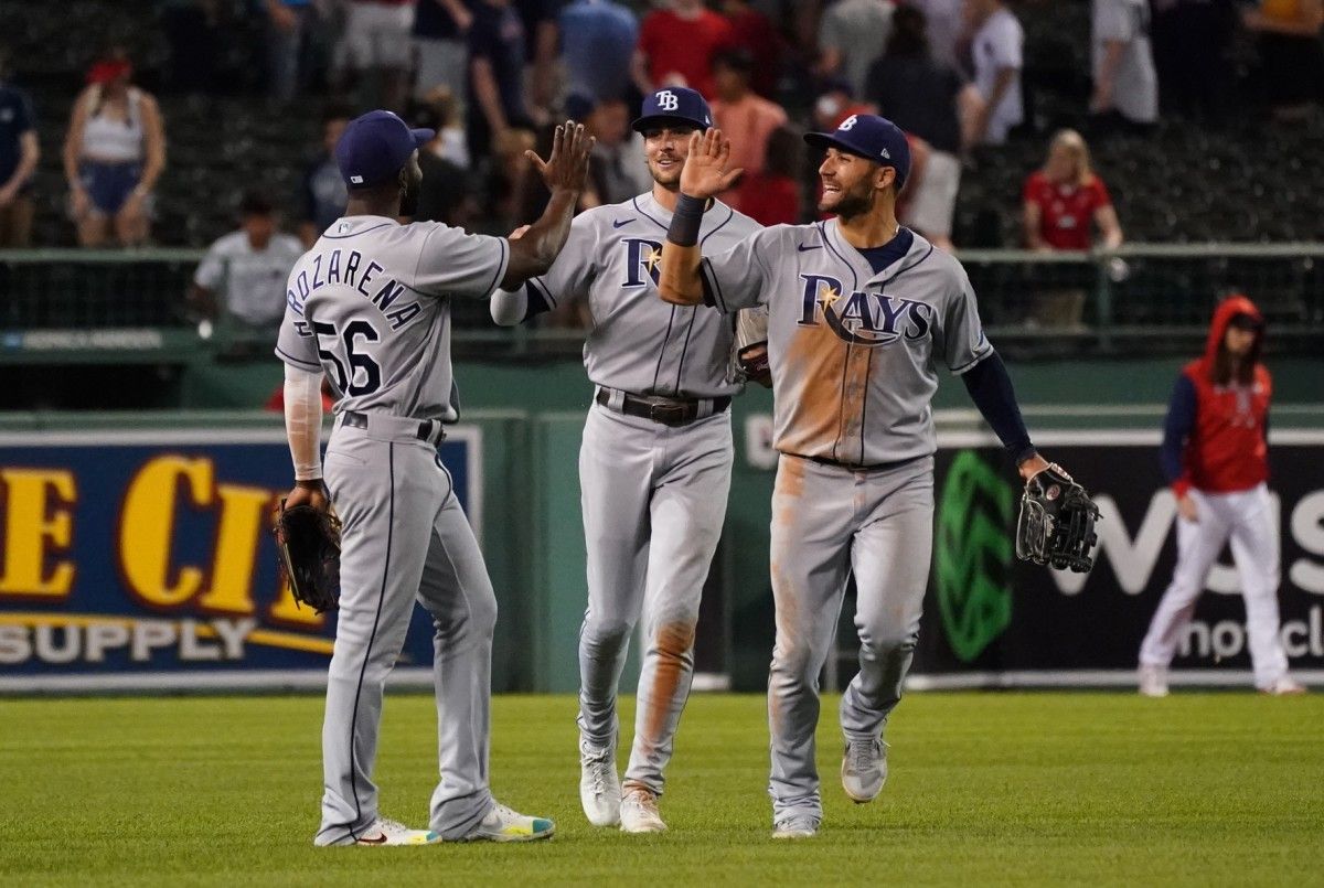 Tampa Bay Rays center fielder Kevin Kiermaier (39), right fielder Josh Lowe (15) and left fielder Randy Arozarena (56) react after defeating the Boston Red Sox in nine innings at Fenway Park. (David Butler II-USA TODAY Sports)