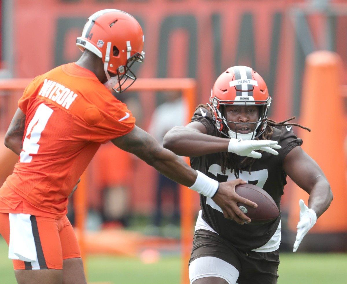 Cleveland Browns quarterback Deshaun Watson hands the ball off to running back Kareem Hunt during OTA practice on Wednesday, May 25, 2022 in Berea.