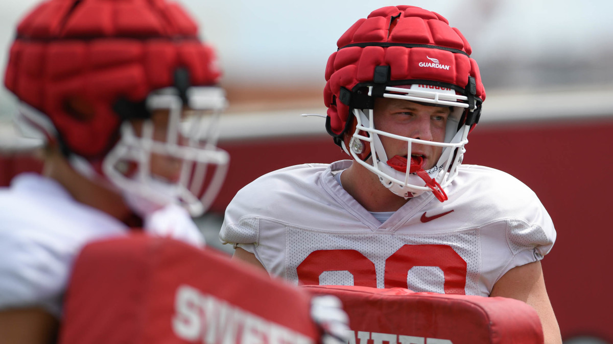 Walk-on turned Arkansas Razorback scholarship tight end Nathan Bax listens to instructions during training camp in early August in Fayetteville.