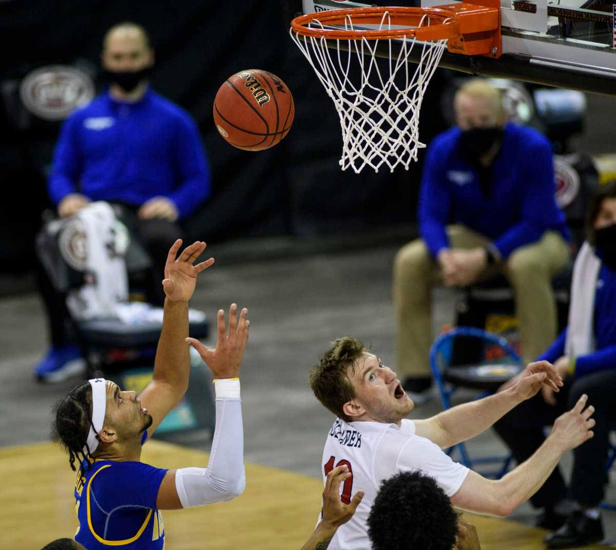 Morehead State s Johni Broome (4) prepares to rebound as Belmont s Caleb Hollander (10) watches his shot miss the net during the first half of the Ohio Valley Conference Basketball Championship at the Ford Center in Evansville, Ind., Saturday, March 6, 2021. Ovc Mens Championship 9