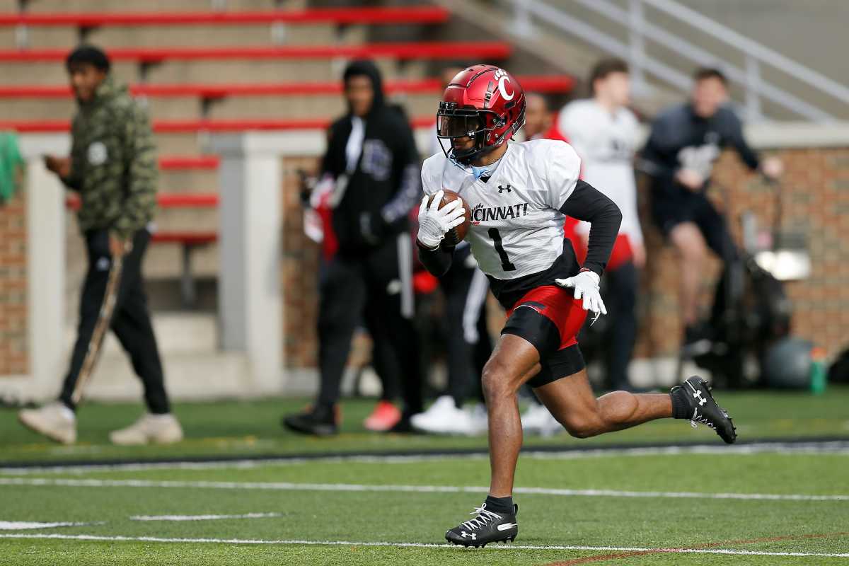 Cincinnati Bearcats wide receiver Tre Tucker (1) runs back the ball during a spring practice at Nippert Stadium in Cincinnati on Thursday, March 24, 2022. Cincinnati Bearcats Spring Practice