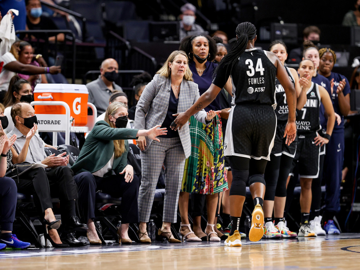 Minnesota center Sylvia Fowles approaches Lynx coach Cheryl Reeve on the sidelines.