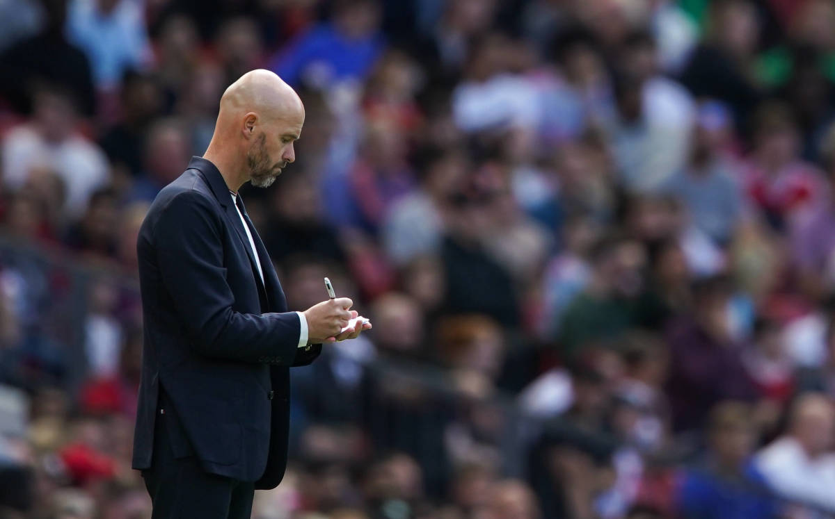 Manchester United manager Erik ten Hag pictured making notes during a pre-season friendly at Old Trafford in August 2022
