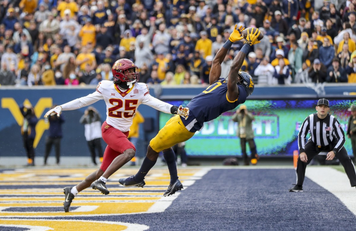 Oct 30, 2021; Morgantown, West Virginia, USA; West Virginia Mountaineers wide receiver Bryce Ford-Wheaton (0) catches a pass for a touchdown during the third quarter against the Iowa State Cyclones at Mountaineer Field at Milan Puskar Stadium.