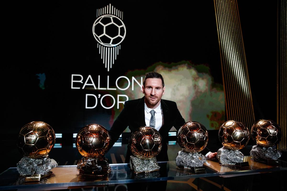 Lionel Messi pictured in 2019 with his six Ballon d'Or trophies