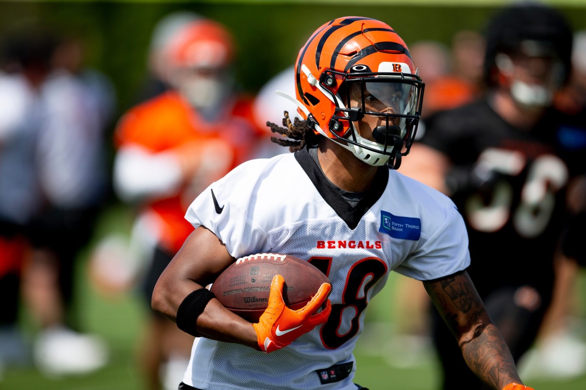 Cincinnati Bengals wide receiver Kwamie Lassiter II (18) runs downfield with the ball after making a catch during Cincinnati Bengals preseason training camp at the Paul Brown Stadium training facility in Cincinnati on Thursday, July 28, 2022. Cincinnati Bengals Training Camp 183