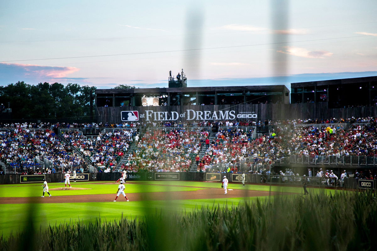 The sun sets during a Major League Baseball game between the Cincinnati Reds and Chicago Cubs, Thursday, Aug. 11, 2022, at the Field of Dreams in Dyersville, Iowa.