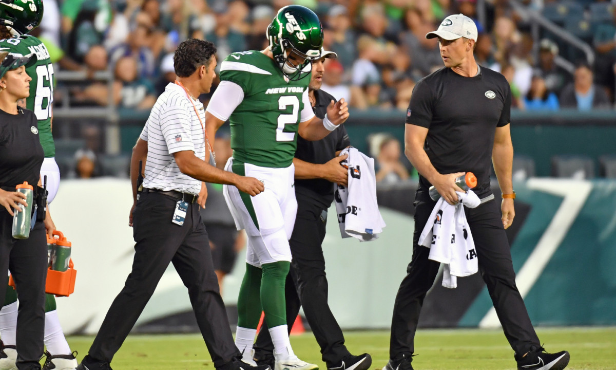 Aug 12, 2022; Philadelphia, Pennsylvania, USA; New York Jets quarterback Zach Wilson (2) is helped off the field against the Philadelphia Eagles during the first quarter at Lincoln Financial Field.