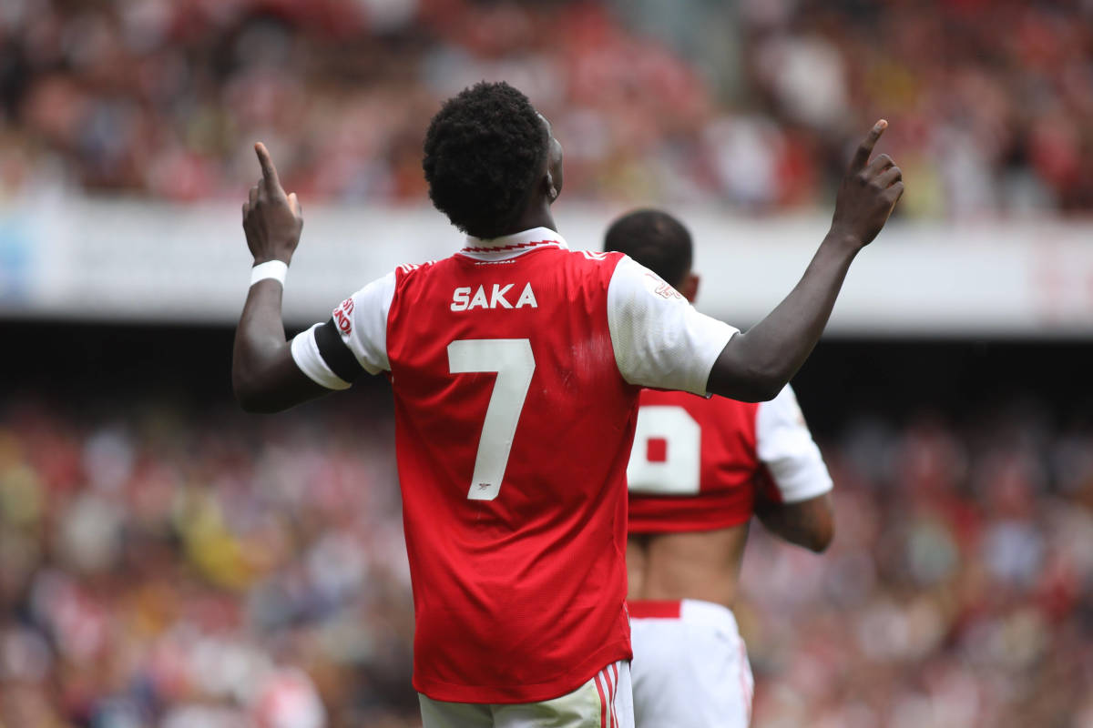 Bukayo Saka pictured celebrating a goal for Arsenal against Sevilla in a 2022 pre-season friendly
