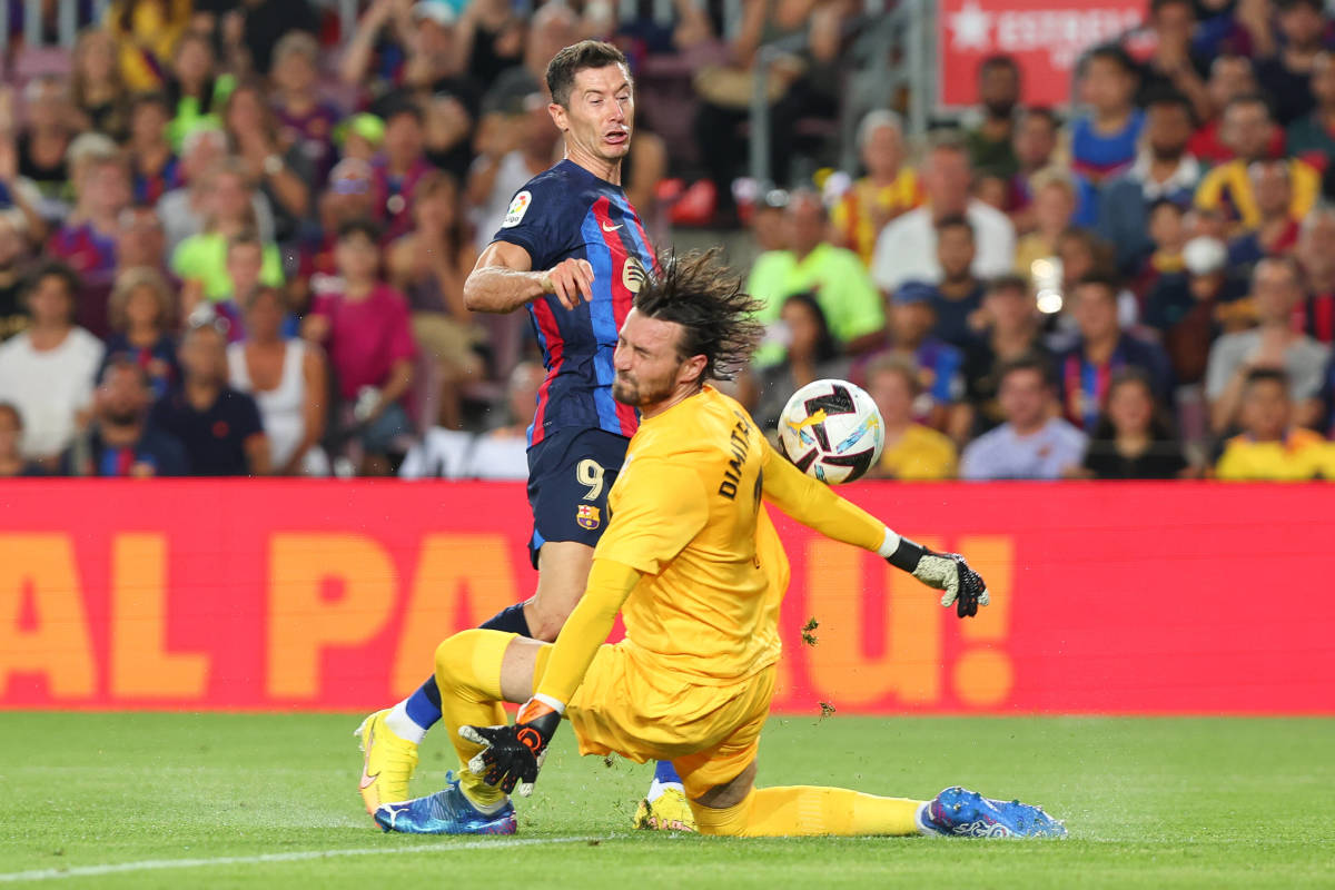 Rayo Vallecano goalkeeper Stole Dimitrievski pictured making a save against Robert Lewandowski on the striker's Barcelona debut in August 2022