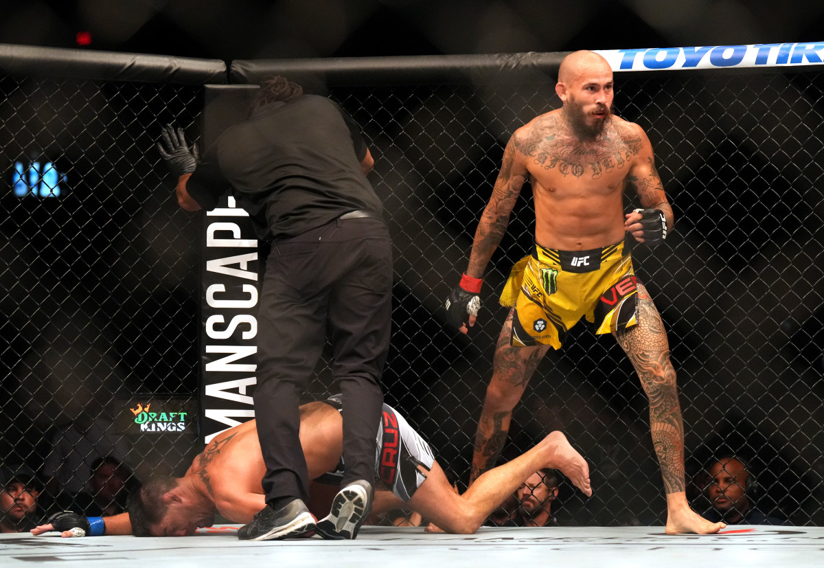 Marlon Vera (red gloves) reacts after defeating Dominick Cruz (blue gloves) during UFC Fight Night at Pechanga Arena.