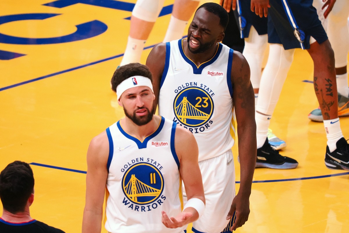 May 20, 2022; San Francisco, California, USA; Golden State Warriors guard Klay Thompson (11) and forward Draymond Green (23) react after Thompson is called for a foul against the Dallas Mavericks during the second quarter of game two of the 2022 western conference finals at Chase Center. Mandatory Credit: Kelley L Cox-USA TODAY Sports