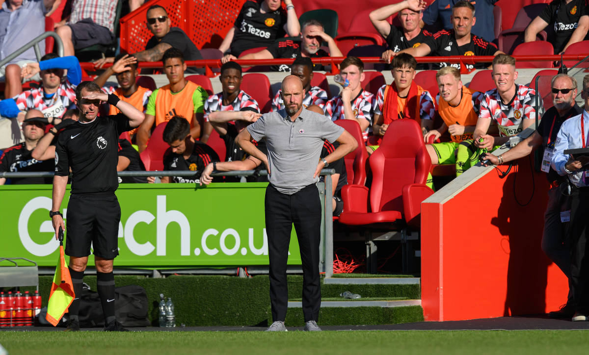 Erik ten Hag pictured standing with his hands on his hips while watching Manchester United lose 4-0 at Brentford in August 2022