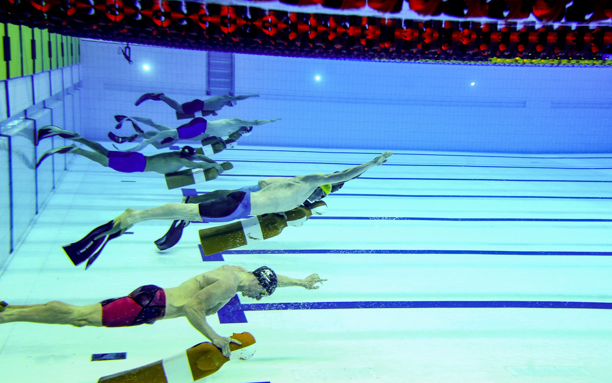 Competitive lifesaving involves equipment of many kinds, including fins.