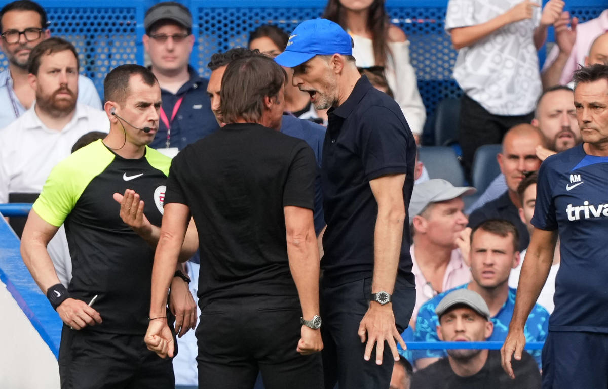 Chelsea manager Thomas Tuchel pictured (in blue baseball cap) squaring up to Tottenham boss Antonio Conte at Stamford Bridge in August 2022