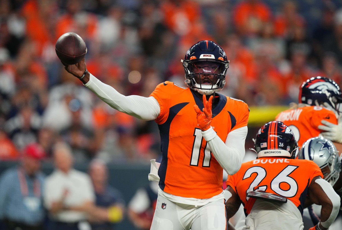 Denver Broncos quarterback Josh Johnson (11) passes the ball in the first quarter against the Dallas Cowboys at Empower Field at Mile High.