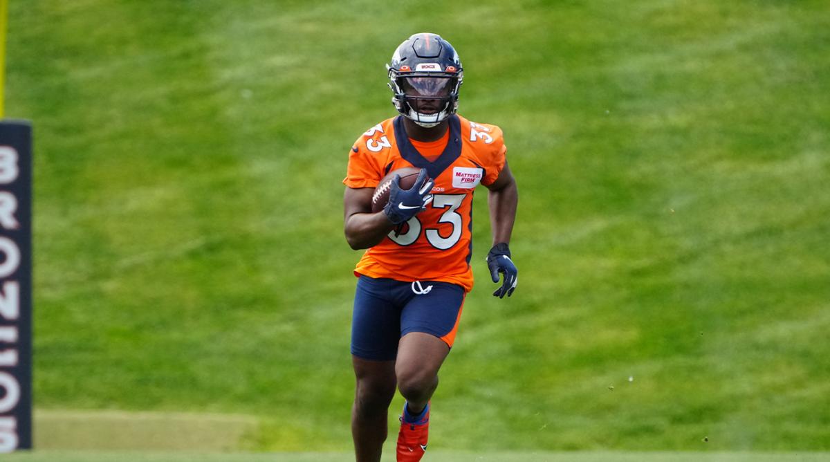 Jun 6, 2022; Englewood, Colorado, USA; Denver Broncos running back Javonte Williams (33) runs with the ball during OTA workouts at the UC Health Training Center.