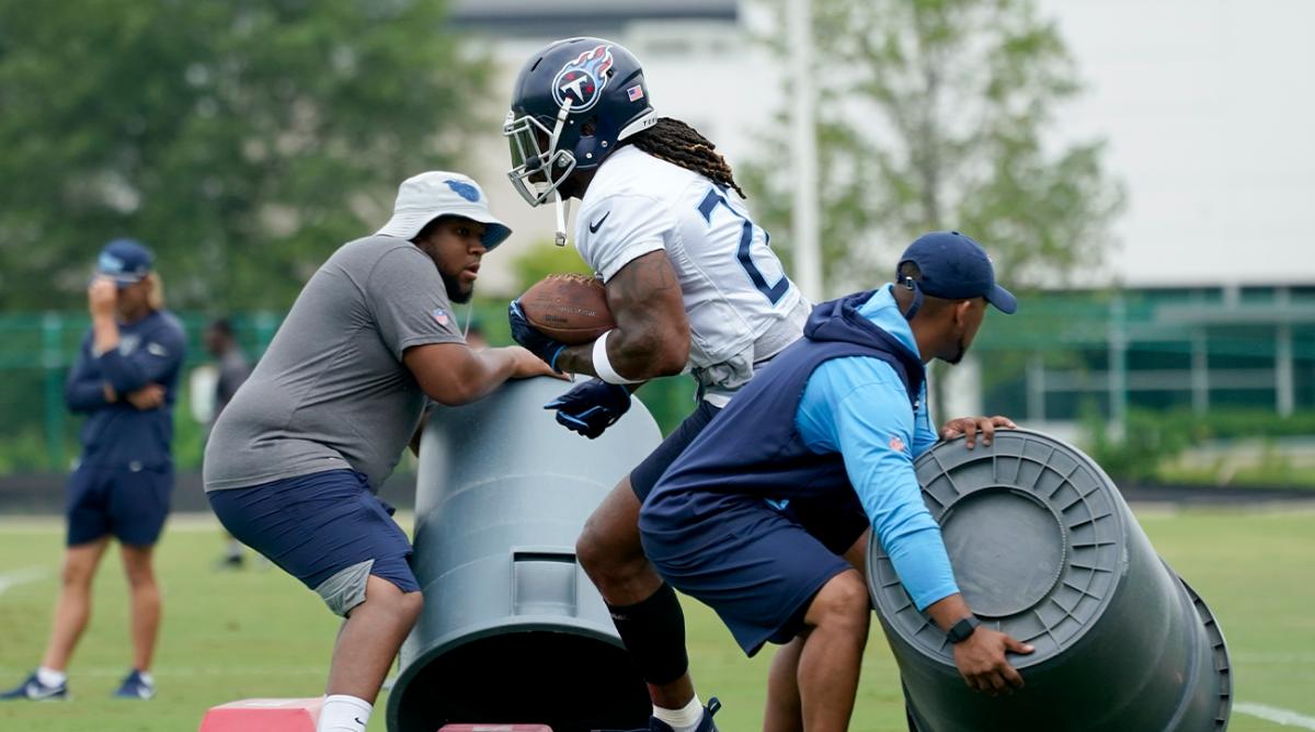Tennessee Titans running back Derrick Henry (22) runs a drill during training camp at the NFL football team’s practice facility Thursday, July 28, 2022, in Nashville, Tenn.