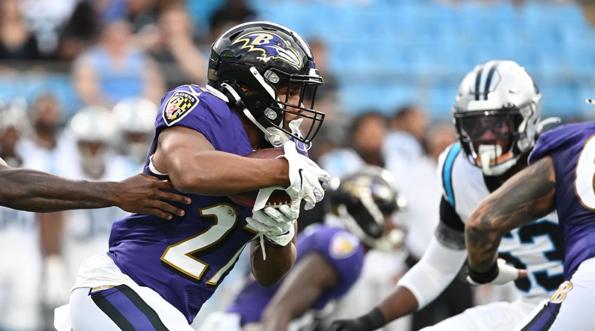Aug 21, 2021; Charlotte, North Carolina, USA; Baltimore Ravens running back J.K. Dobbins (27) with the ball in the first quarter at Bank of America Stadium.