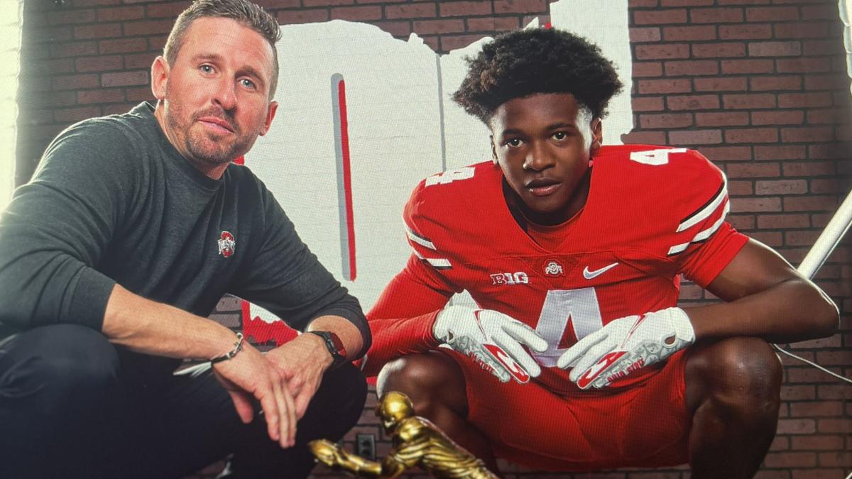Ohio State receiver Jeremiah Smith with offensive coordinator Brian Hartline 