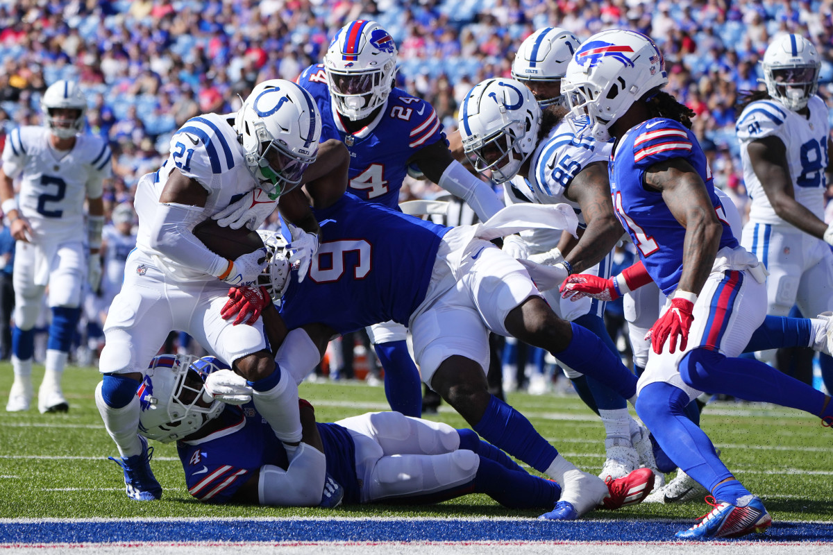 Aug 13, 2022; Orchard Park, New York, USA; Buffalo Bills linebacker Andre Smith (9) and safety Jaquan Johnson (4) prevent Indianapolis Colts running back Nyheim Hines (21) from scoring during the first half at Highmark Stadium.