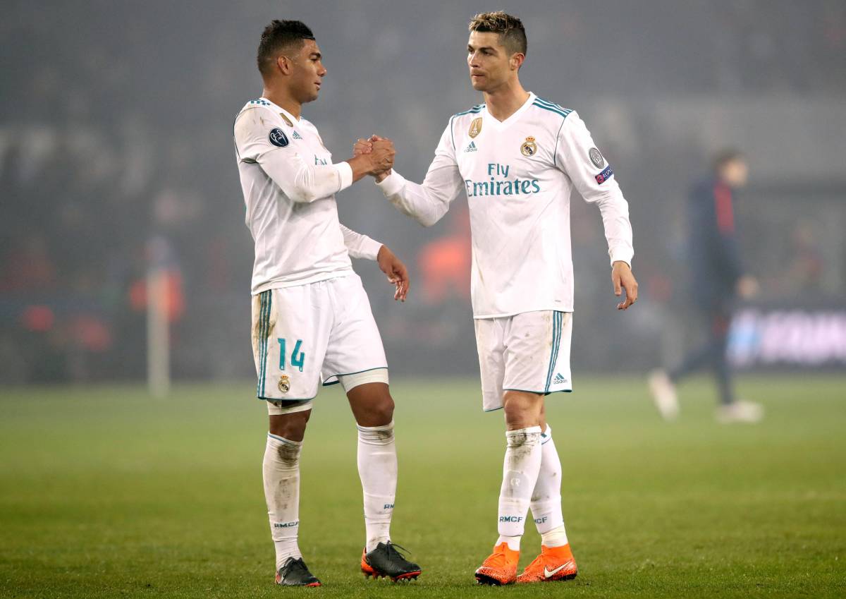 Casemiro (left) and Cristiano Ronaldo pictured shaking hands during Real Madrid's game against PSG in 2018