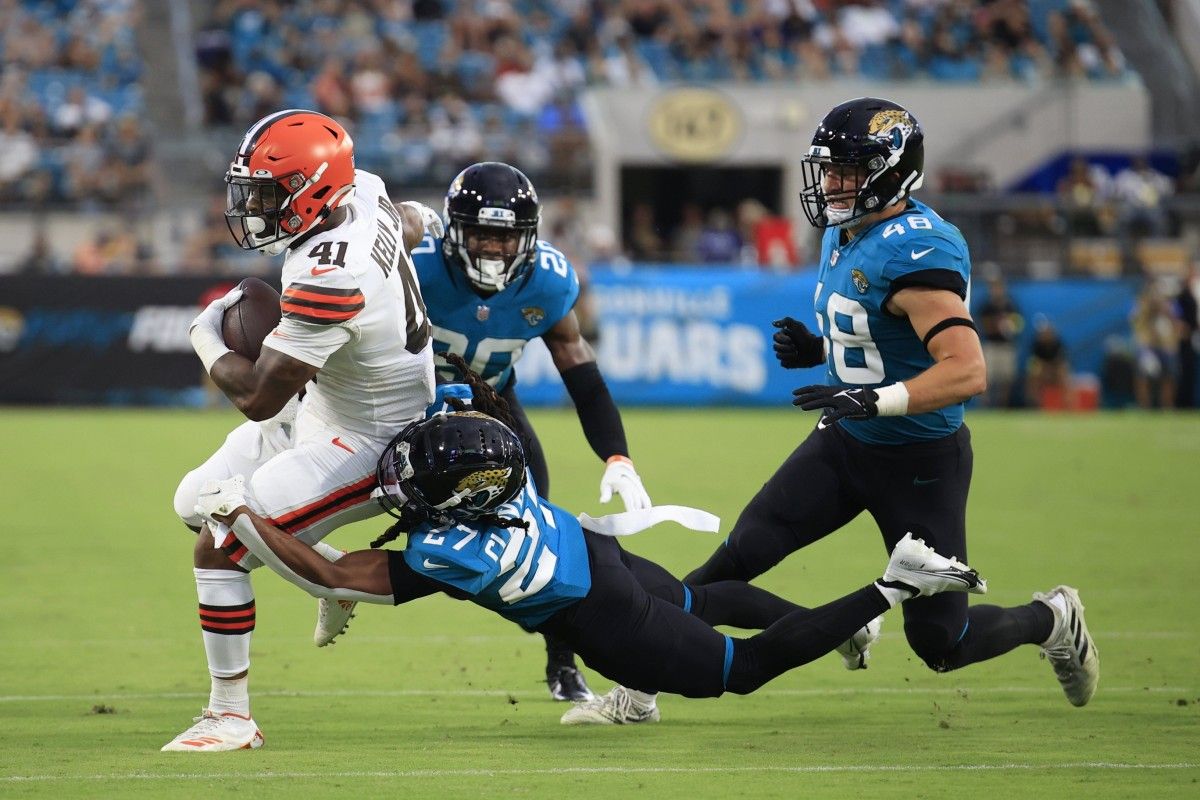 Jacksonville Jaguars cornerback Chris Claybrooks (27) tackles Cleveland Browns running back John Kelly Jr. (41) during the second quarter of a preseason NFL game Friday, Aug. 12, 2022 at TIAA Bank Field in Jacksonville. [Corey Perrine/Florida Times-Union] Jacksonville Jaguars 2022 Cleveland Browns First Home Pre Season Scrimmage Second Scrimmage Preseason