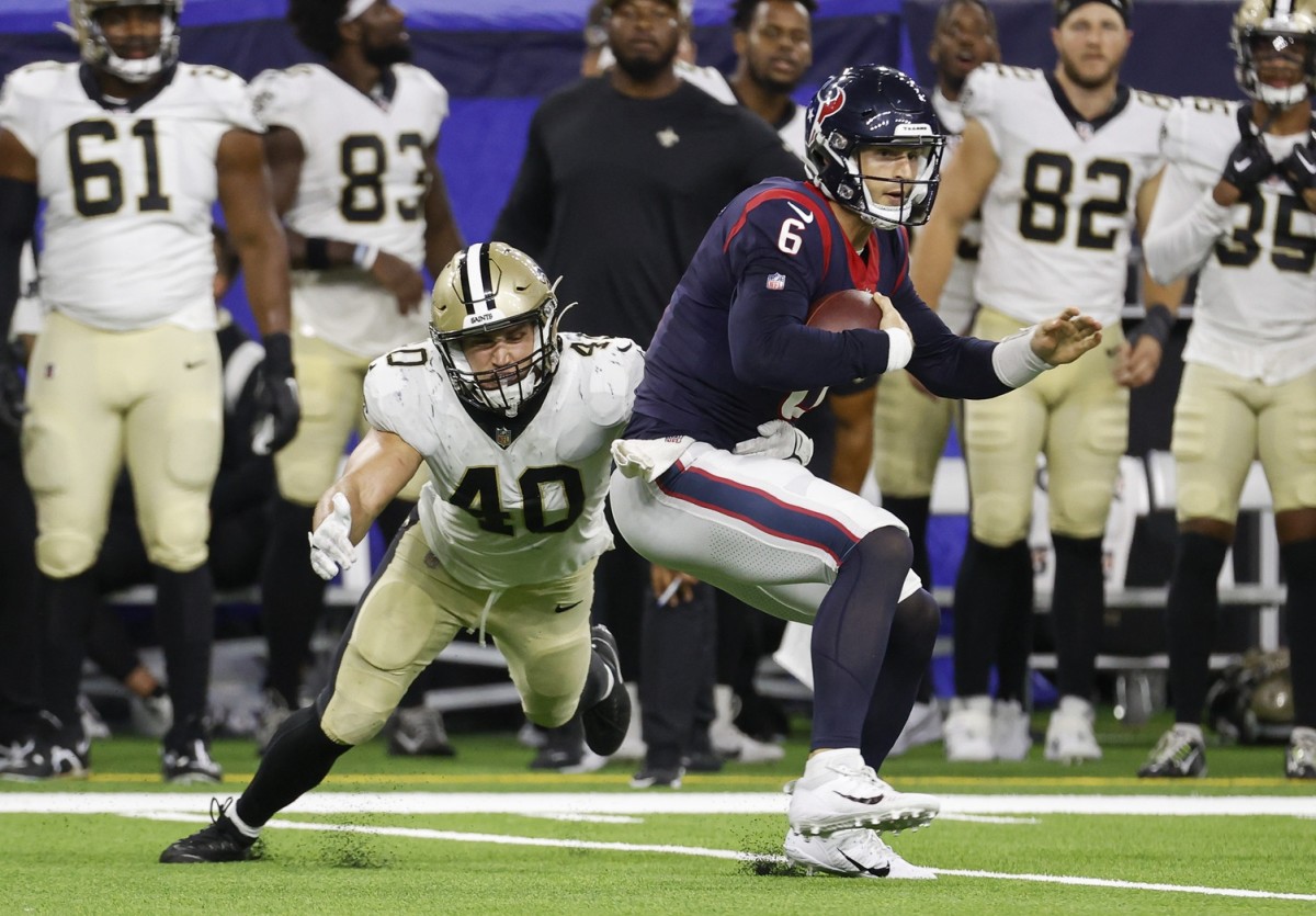 Aug 13, 2022; Houston, Texas, USA; Houston Texans quarterback Jeff Driskel (6) runs with the ball as New Orleans Saints linebacker Chase Hansen (40) attempts to make a tackle during the third quarter at NRG Stadium. Mandatory Credit: Troy Taormina-USA TODAY Sports