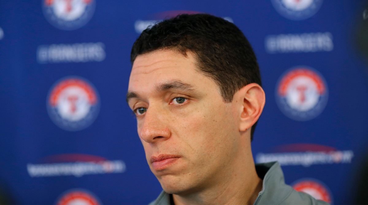 FILE - Texas Rangers general manager Jon Daniels speaks to reporters during baseball spring training in Surprise, Ariz., Feb. 15, 2018. Daniels is out as president of baseball operations for the Texas Rangers after 17 years leading the club. Team owner Ray Davis said Wednesday, Aug. 17, 2022, that Daniels was being relieved of his duties immediately after the decision was made not to renew his contract at the end of the season.