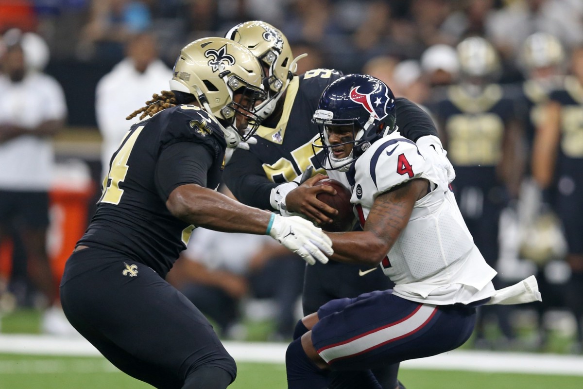 Sep 9, 2019; Former Houston Texans quarterback Deshaun Watson (4) is sacked by New Orleans Saints defensive end Cameron Jordan (94) and defensive tackle Taylor Stallworth (95). Mandatory Credit: Chuck Cook-USA TODAY Sports