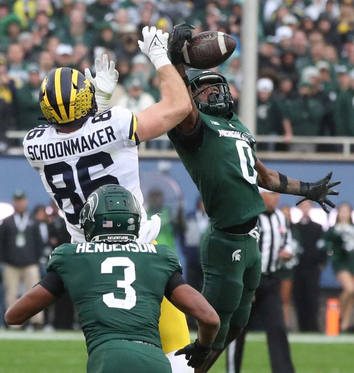 Michigan State Spartans cornerback Charles Brantley (0) intercepts a pass to Michigan Wolverines tight end Luke Schoonmaker (86) during the final seconds of action to seal MSU's 37-33 win Saturday, Oct. 30, 2021. Msu Mich