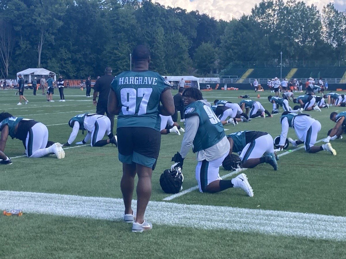 Javon Hargrave (97) and Jordan Davis chop it up prior to practice vs. Browns on Day 1