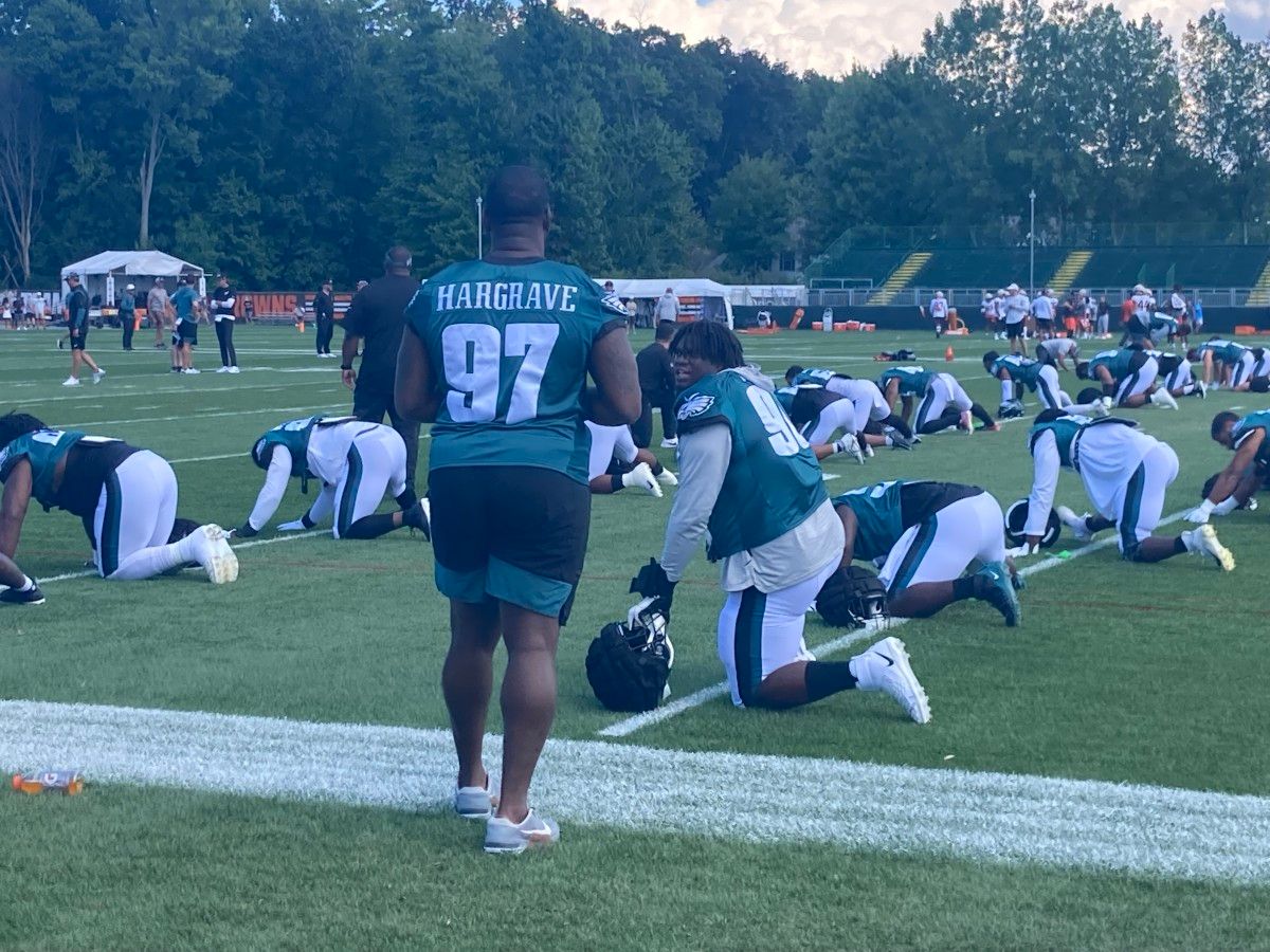 Javon Hargrave (97) and Jordan Davis chop it up prior to practice vs. Browns on Day 1