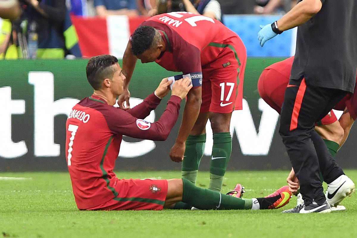 Cristiano Ronaldo (left) pictured giving his captain's armband to Portugal teammate Nani during the final of Euro 2016
