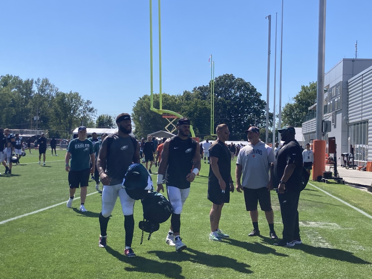 Kyzir White (left) and T.J. Edwards leave the field after Day 1 of joint practices with the Browns