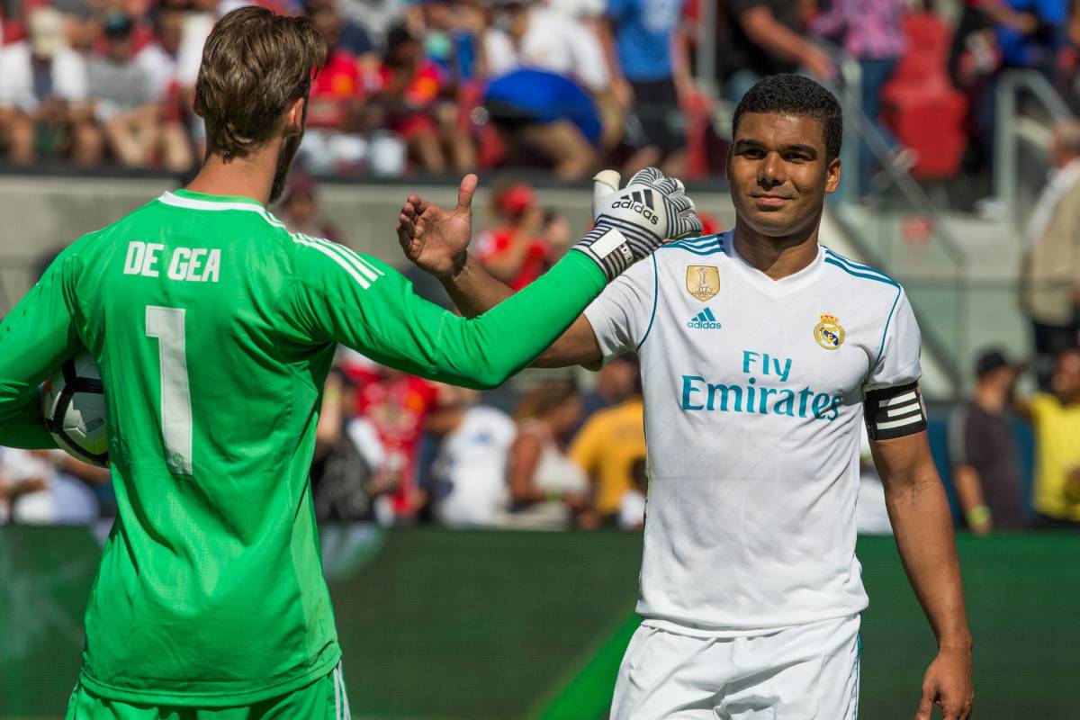 David de Gea and Casemiro pictured shaking hands during a pre-season friendly between Manchester United and Real Madrid in 2017