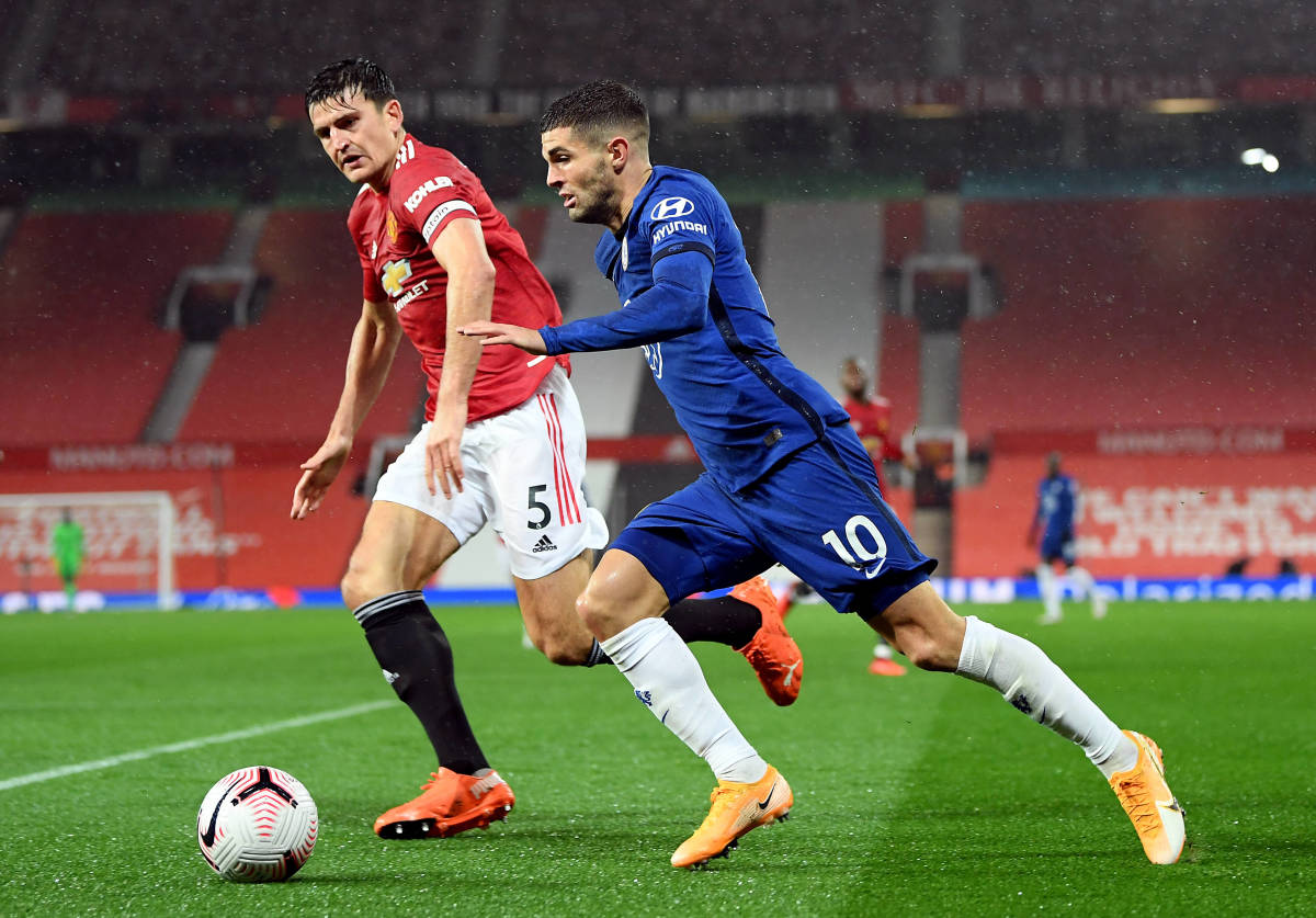 Harry Maguire (left) and Christian Pulisic pictured during a Premier League match between Manchester United and Chelsea at Old Trafford in October 2020